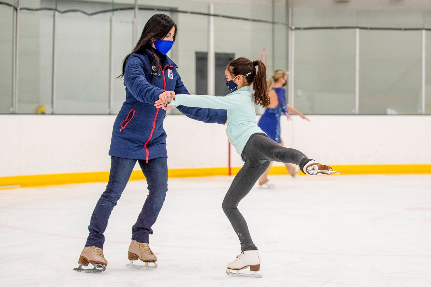 Skating coach and student